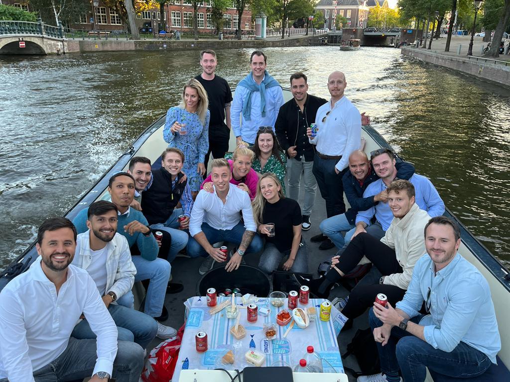 Team on a boat in Amsterdam
