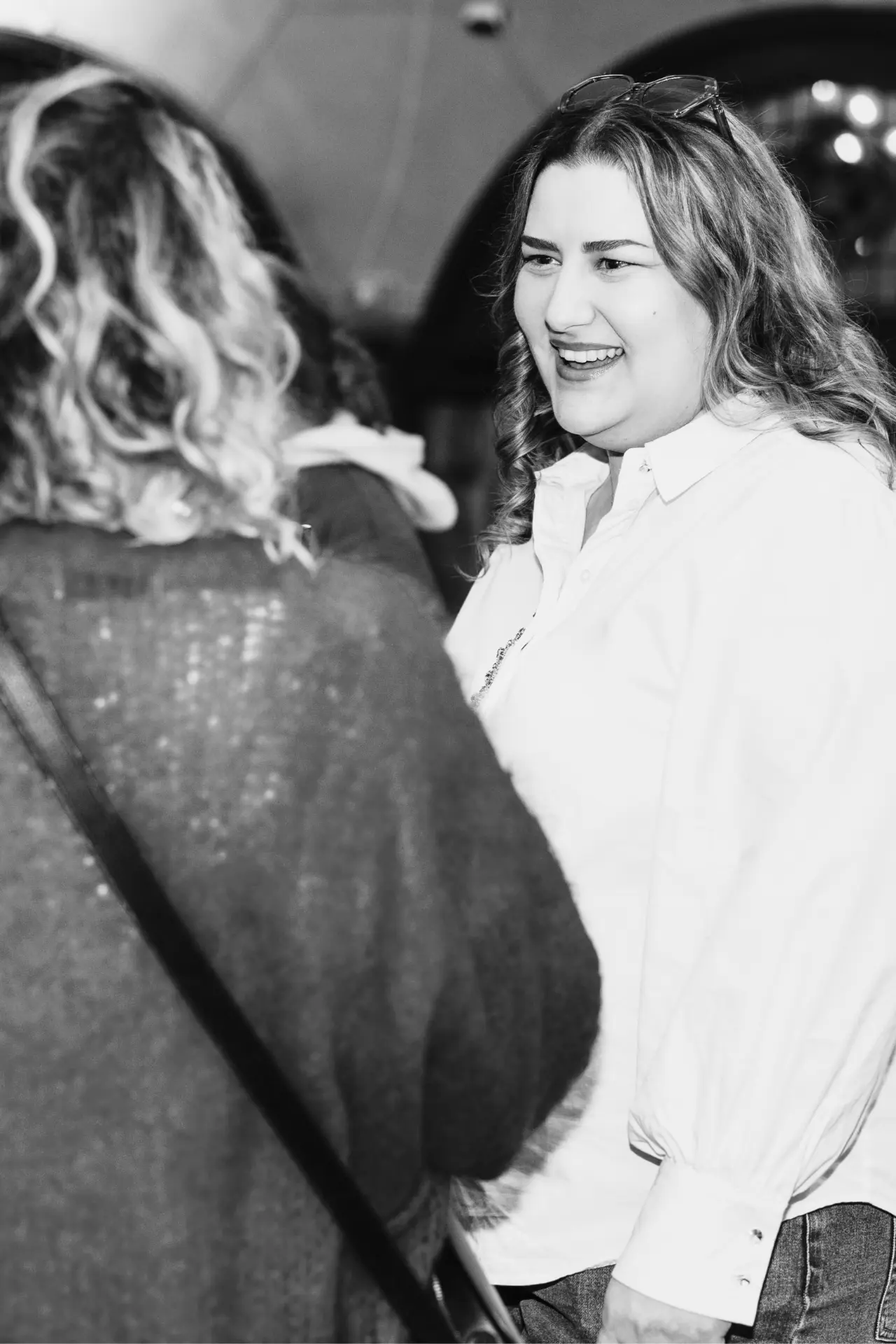 Yoana Leusin in conversation with a guest at an impowr event